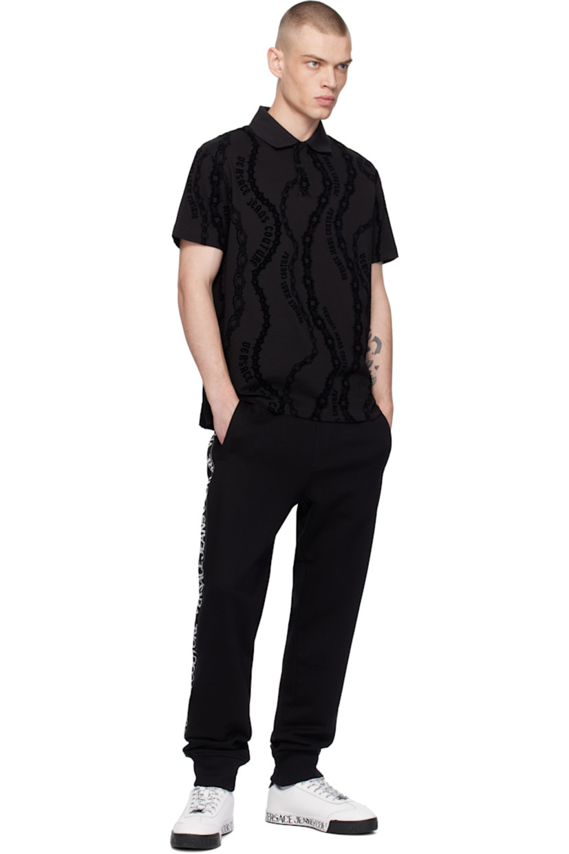 Cotton jersey polo. Logo graphic pattern flocked throughout. 

· Rib-knit spread collar and cuffs
· Two-button placket
· Tennis-tail hem

Supplier color: Black