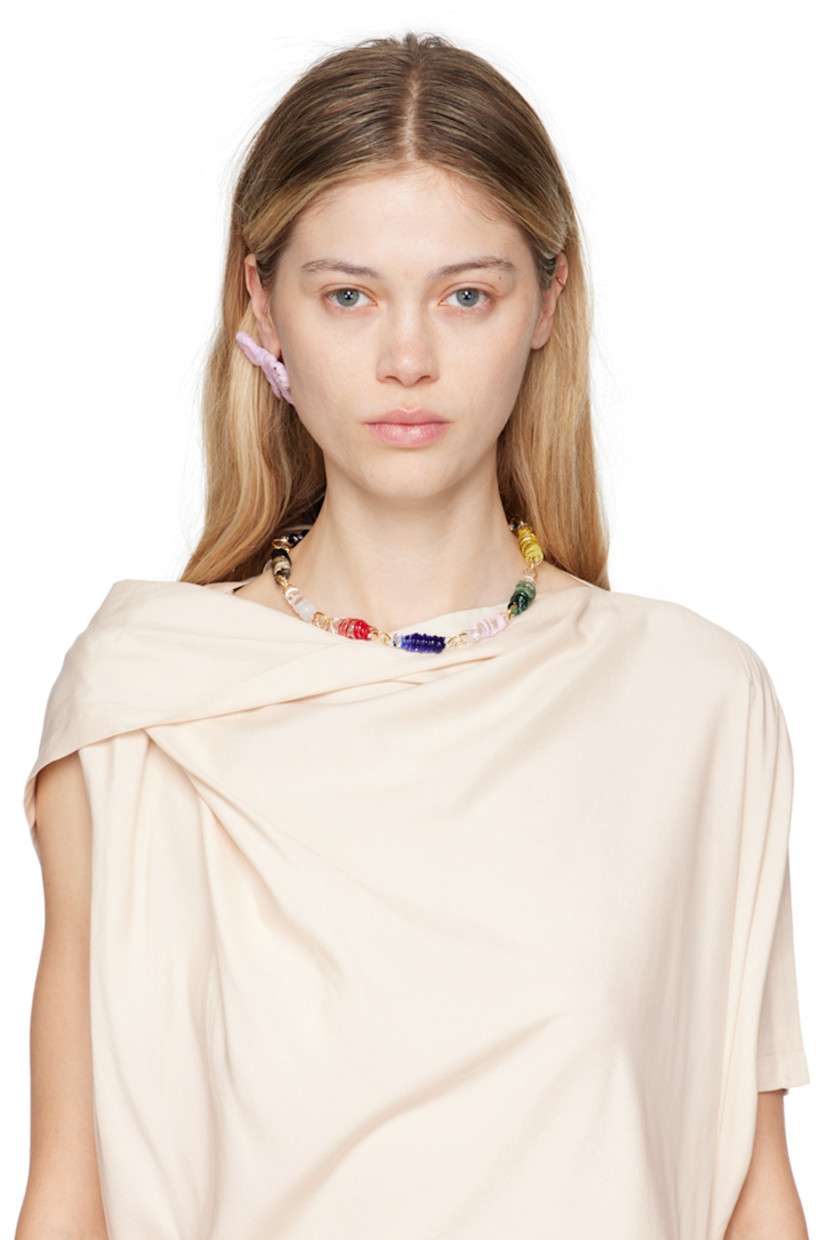Single handcrafted borosilicate glass drop earring in pink.

· Graphic at face
· Gold-tone brass post-stud fastening
· H1.75" x W2"

Each item is unique. Please note finishings may vary. 

Supplier color: Pink
