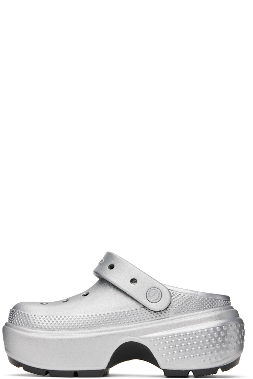 Lightweight Croslite™ foam rubber slip-on loafers in metallic silver tone.

· Perforations and textured detailing throughout
· Detachable studs at logo-embossed slingback strap
· Molded Crocs Comfort™ rubber footbed
· Rubber block heel
· Platform rubber midsole
· Treaded rubber sole
· Platform: H2"
· Heel: H2.75"

Supplier color: Silver