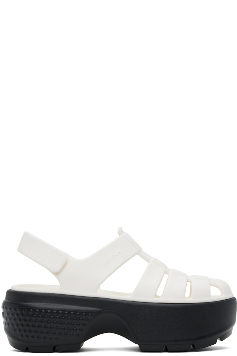 Rubber flat sandals in white.

· Cutouts throughout
· Velcro slingback strap
· Logo embossed at outer side
· Logo embossed at heel counter
· Molded rubber footbed
· Platform rubber midsole
· Treaded rubber sole
· Platform: H2.75"

Supplier color: Chalk