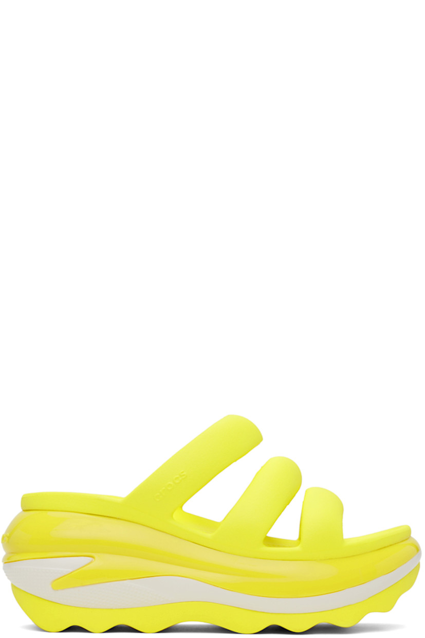 Croslite™ rubber slip-on flat sandals in yellow.

· Open toe
· Padded straps at vamp
· Logo-embossed outer side and heel
· Molded rubber footbed
· Sculptural platform rubber midsole
· Treaded rubber sole
· Platform: H3"

Supplier color: Acidity