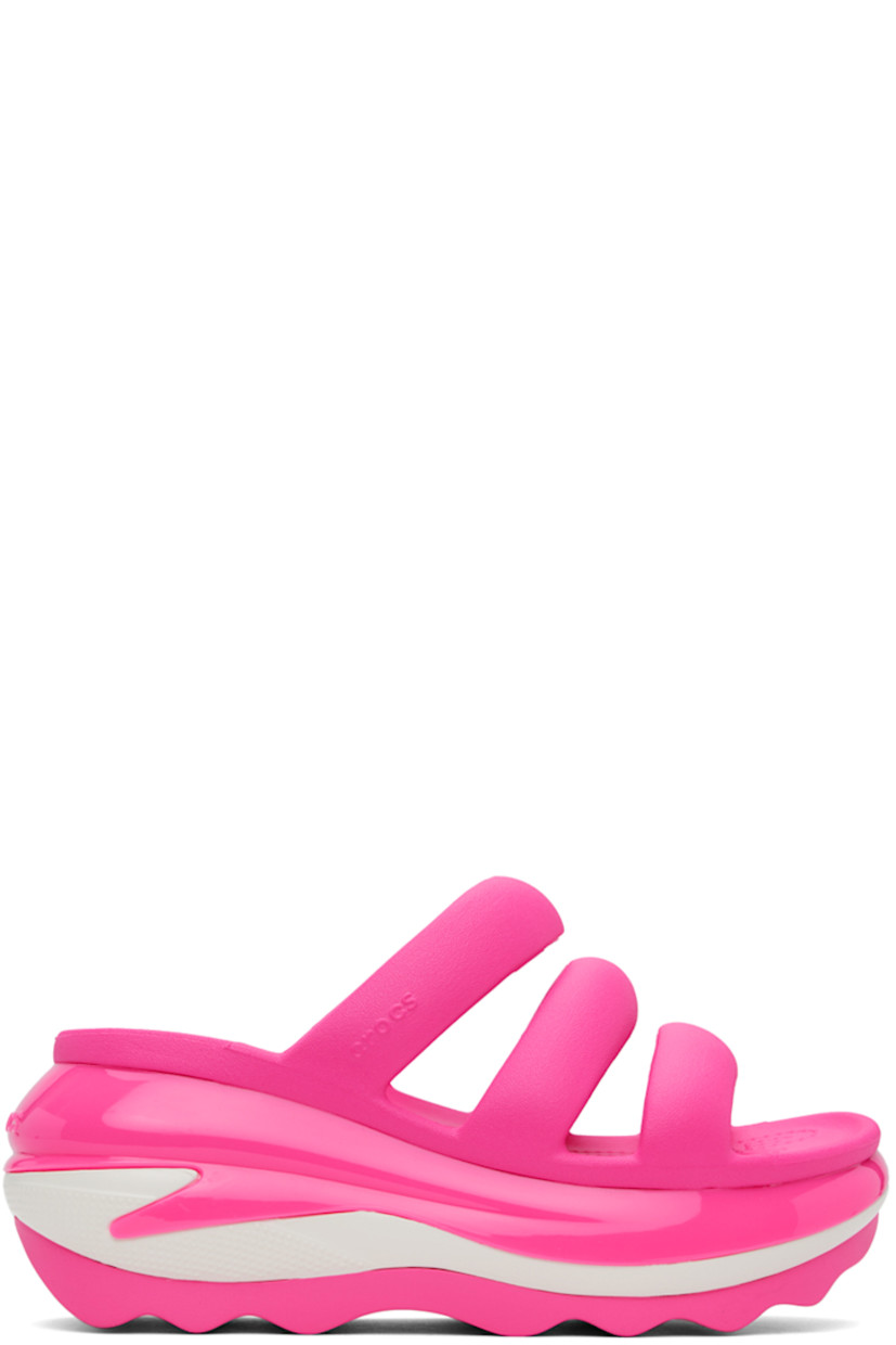Croslite™ rubber slip-on flat sandals in pink.

· Open toe
· Padded straps at vamp
· Logo-embossed outer side and heel
· Molded rubber footbed
· Sculptural platform rubber midsole
· Treaded rubber sole
· Platform: H3"

Supplier color: Pink crush