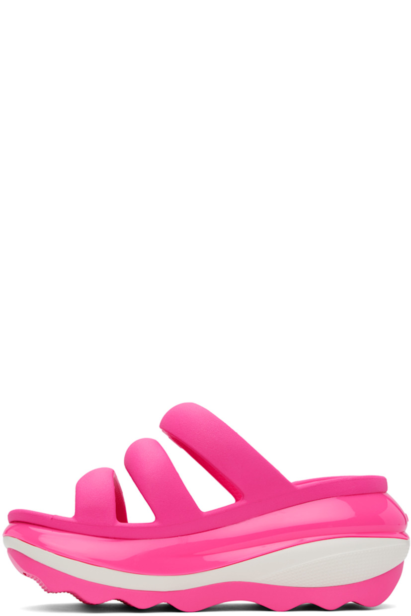 Croslite™ rubber slip-on flat sandals in pink.

· Open toe
· Padded straps at vamp
· Logo-embossed outer side and heel
· Molded rubber footbed
· Sculptural platform rubber midsole
· Treaded rubber sole
· Platform: H3"

Supplier color: Pink crush