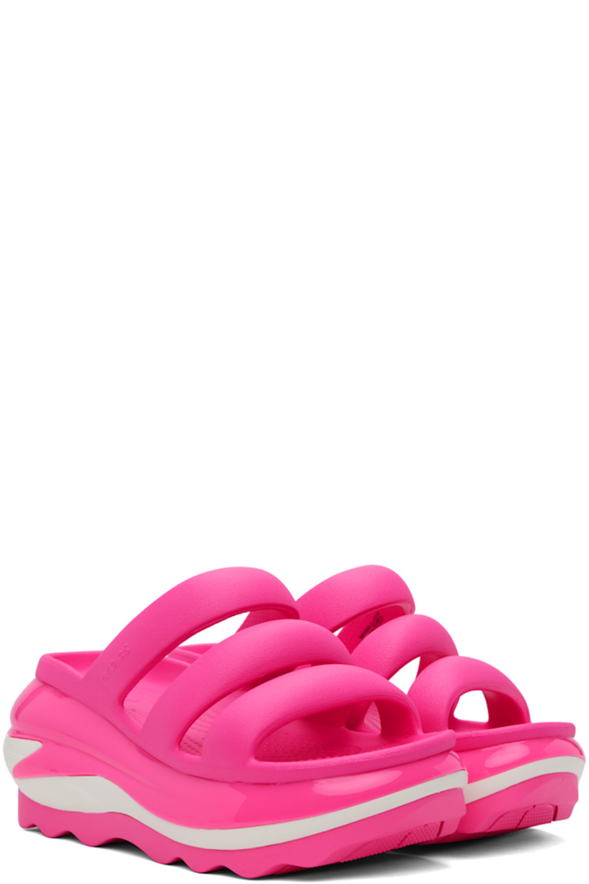Croslite™ rubber slip-on flat sandals in pink.

· Open toe
· Padded straps at vamp
· Logo-embossed outer side and heel
· Molded rubber footbed
· Sculptural platform rubber midsole
· Treaded rubber sole
· Platform: H3"

Supplier color: Pink crush