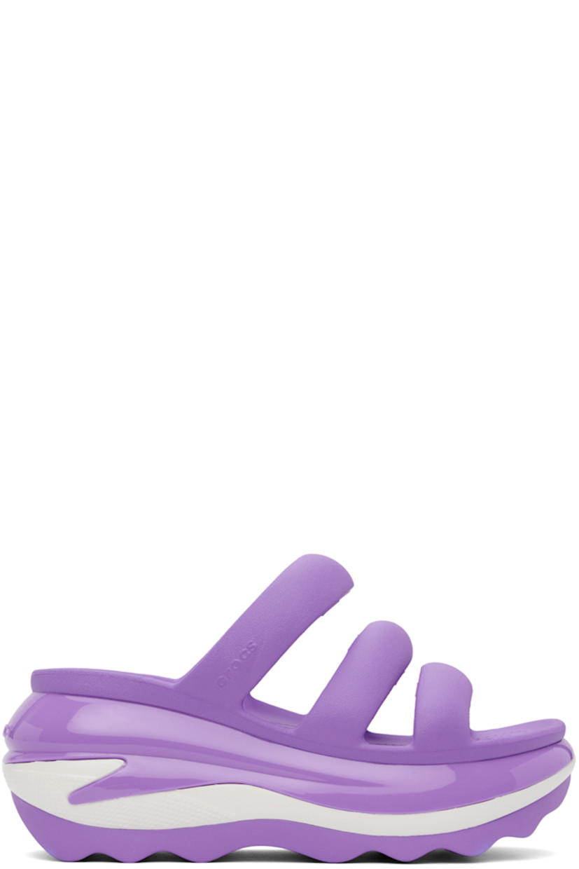 Croslite™ rubber slip-on flat sandals in purple.

· Open toe
· Padded straps at vamp
· Logo-embossed outer side and heel
· Molded rubber footbed
· Sculptural platform rubber midsole
· Treaded rubber sole
· Platform: H3"

Supplier color: Galaxy