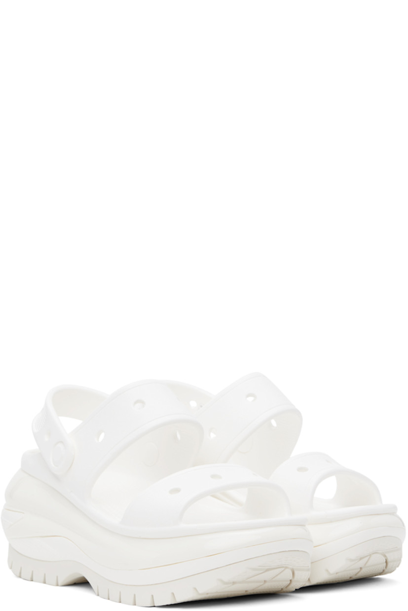 Rubber slip-on flat sandals in white.

· Perforated detailing throughout
· Open toe
· Straps at vamp
· Logo-embossed convertible slingback strap
· Logo embossed at heel
· Molded rubber footbed
· Sculptural platform rubber midsole
· Treaded rubber sole
· Logo-engraved hardware
· Platform: H3"

Supplier color: White