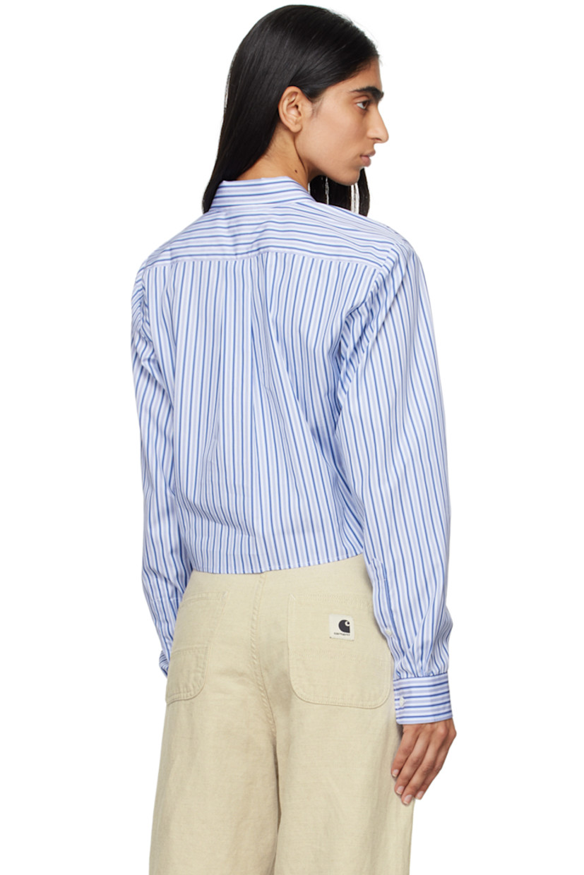 Deadstock cotton poplin shirt. Stripes throughout.

· Spread collar
· Button closure
· Logo graphic embroidered at chest 
· Cropped hem
· Single-button barrel cuffs
· Box pleat at back yoke

Supplier color: Blue stripe
