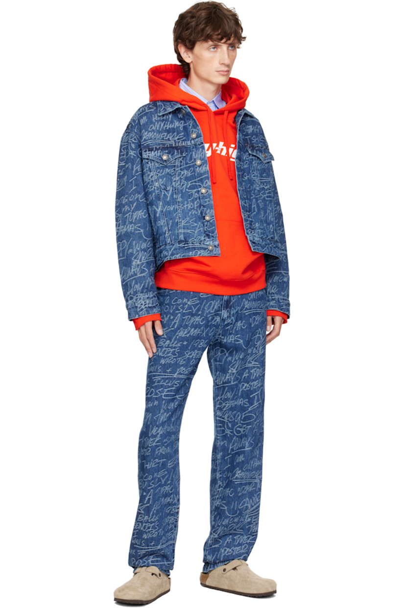 Non-stretch denim jacket. Jacquard graphic pattern and fading throughout.

· Spread collar
· Button closure
· Flap and welt pockets
· Single-button barrel cuffs
· Adjustable button tabs at back hem
· Logo patch at back hem

Featuring artwork by Ben Solomon. 

Supplier color: Dark blue