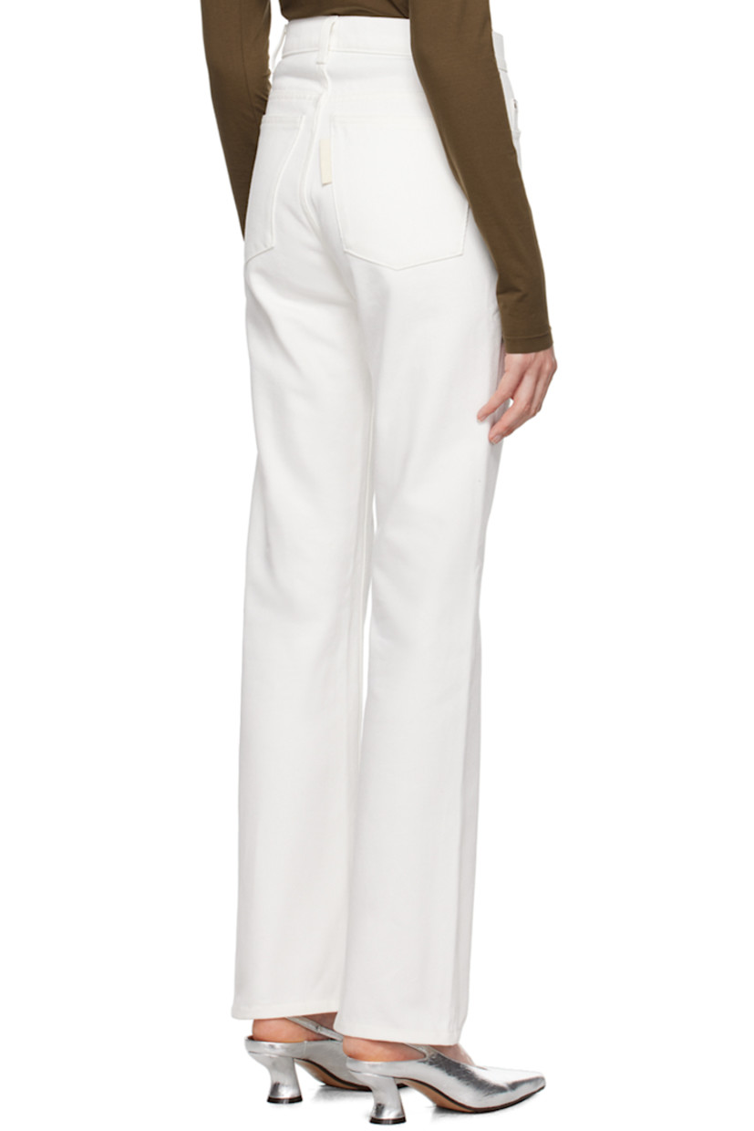 Straight-leg non-stretch organic denim jeans.

· Mid-rise
· Belt loops
· Five-pocket styling
· Button-fly
· Flag at back pocket
· Antiqued gold-tone hardware

Supplier color: White
