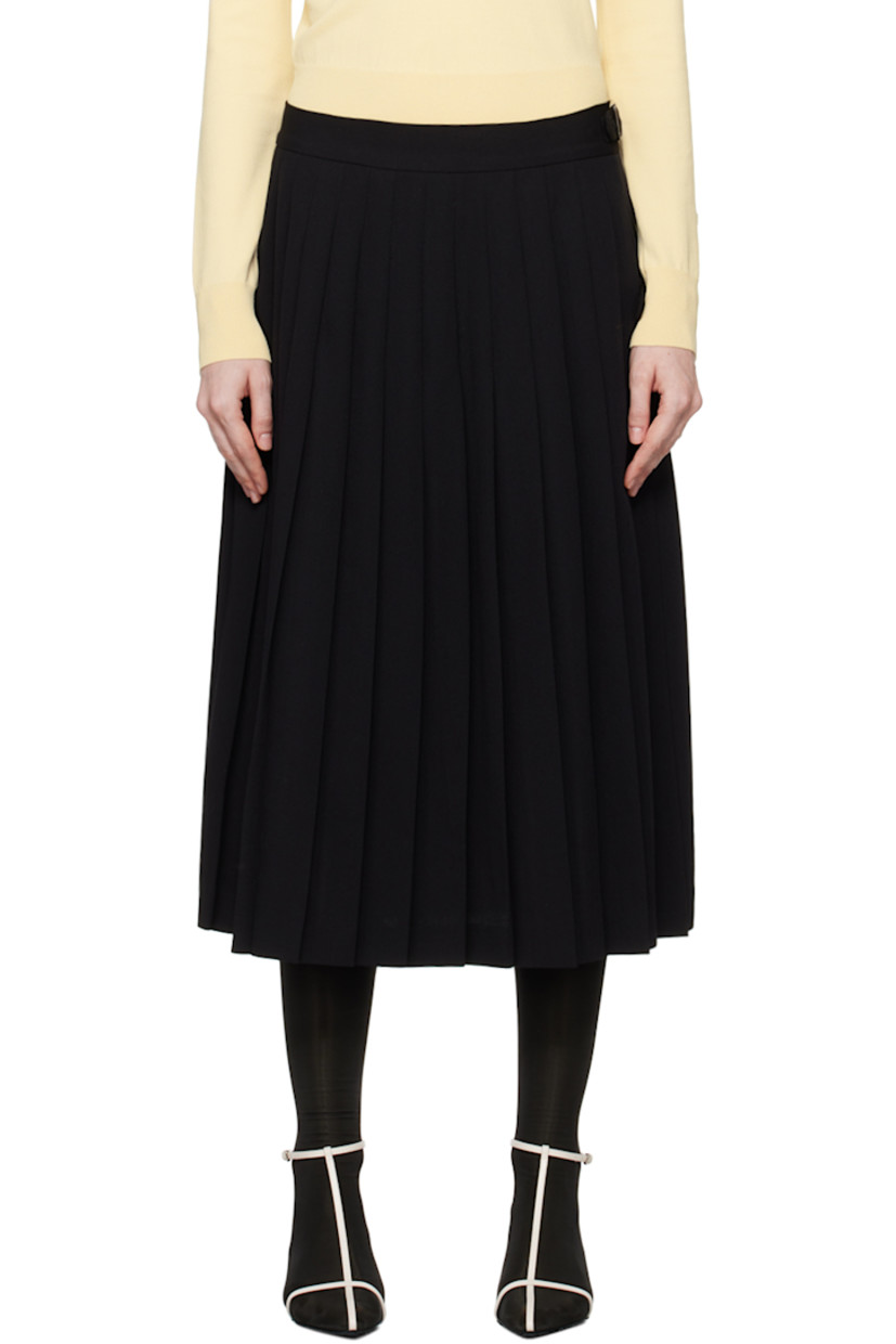 Virgin wool twill skirt. Knife pleats throughout.

· Wrap construction
·� Pin-buckle tab at waistband and side
· Unlined

Supplier color: Black