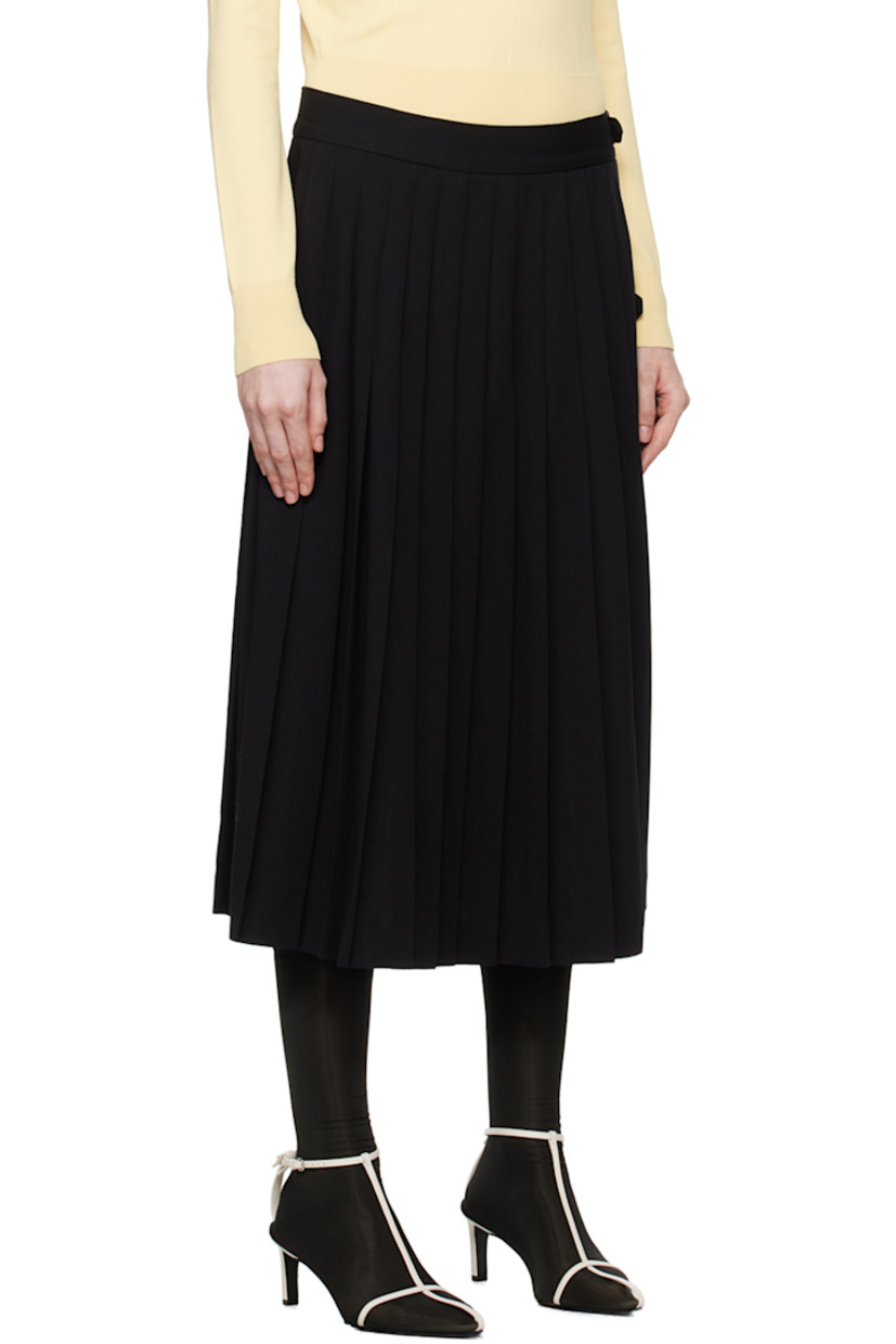 Virgin wool twill skirt. Knife pleats throughout.

· Wrap construction
· Pin-buckle tab at waistband and side
· Unlined

Supplier color: Black