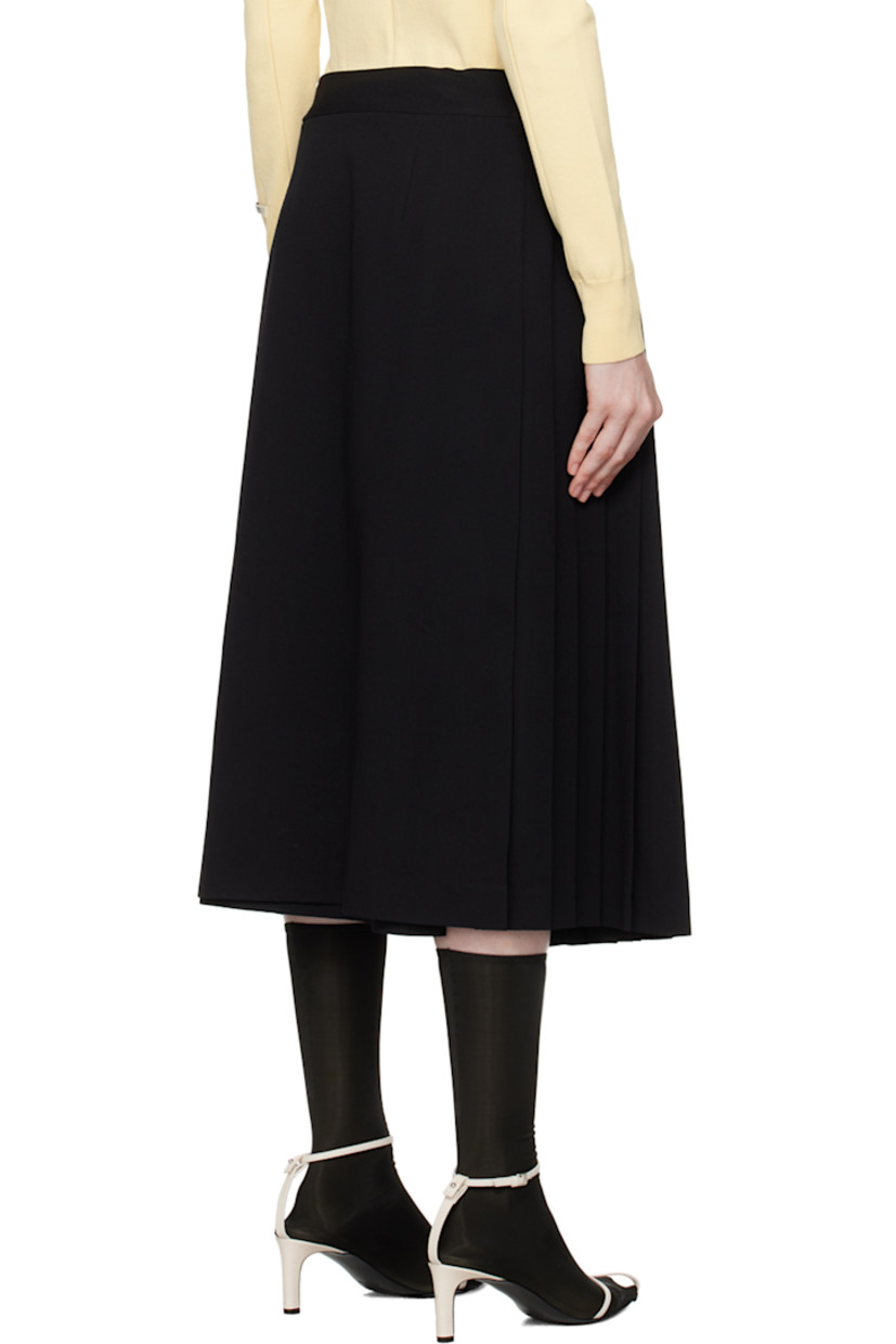 Virgin wool twill skirt. Knife pleats throughout.

· Wrap construction
· Pin-buckle tab at waistband and side
· Unlined

Supplier color: Black