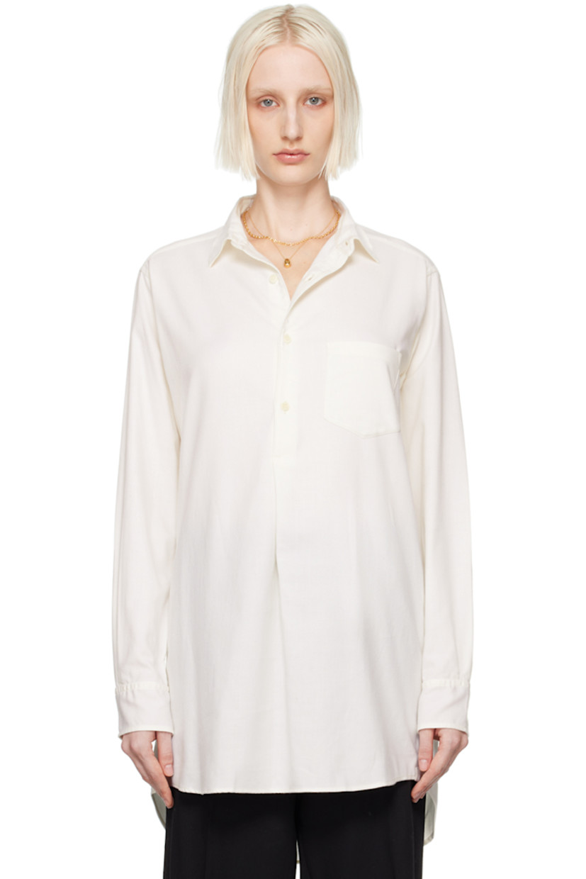 Organic cotton- and cashmere-blend twill shirt.

· Spread collar
· Half-button closure
· Patch pocket
· Droptail hem
· Reinforced trim hand-stitched at side seams
· Logo embroidered at side seam
· Single-button barrel cuffs
· Twin pleats at back yoke

Supplier color: White