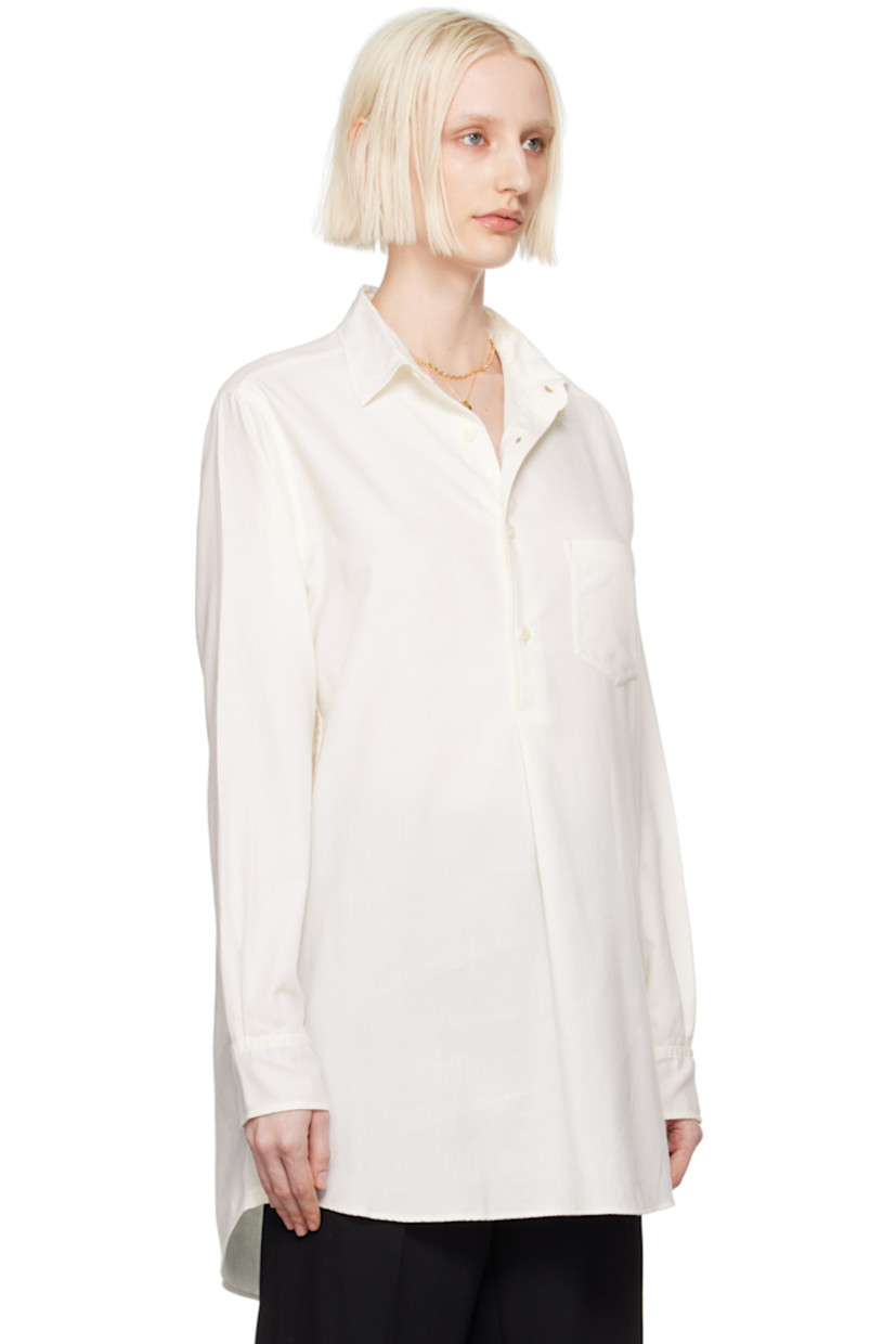 Organic cotton- and cashmere-blend twill shirt.

· Spread collar
· Half-button closure
· Patch pocket
· Droptail hem
· Reinforced trim hand-stitched at side seams
· Logo embroidered at side seam
· Single-button barrel cuffs
· Twin pleats at back yoke

Supplier color: White