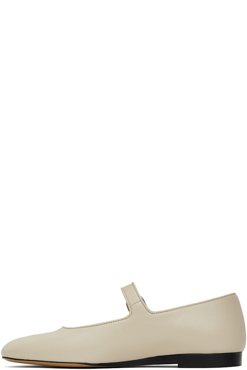 Buffed lambskin Mary Jane-style ballerina flats in off-white.

· Piping at pin-buckle strap and collar
· Logo embossed at cushioned calfskin footbed
· Suede and buffed calfskin lining
· Stacked leather heel with rubber injection
· Leather sole

Supplier color: Ecru