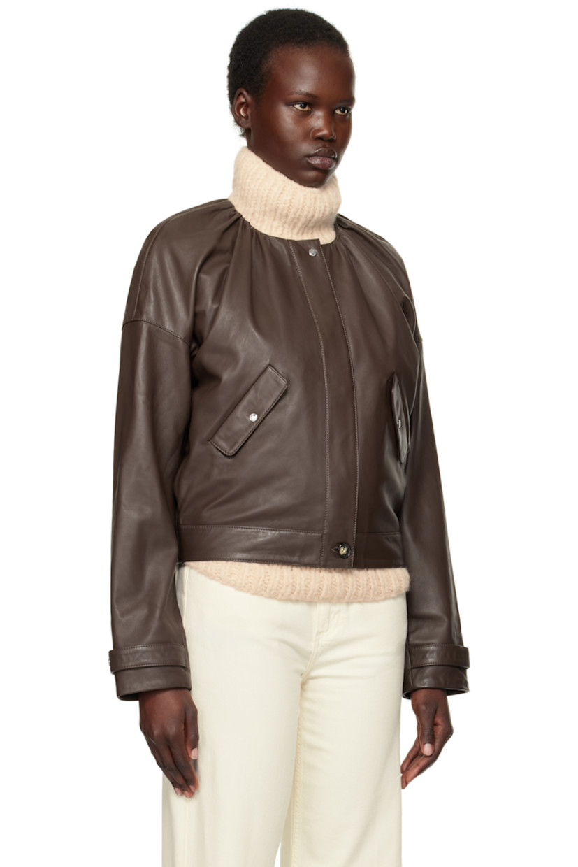 LWG-certified grained lambskin jacket. 

· Gathering at round neck
· Zip closure with press-stud placket
· Flap pockets
· Adjustable press-stud tab at cuffs
· Welt pockets and D-ring at interior
· Full logo-woven satin lining

Supplier color: Chestnut