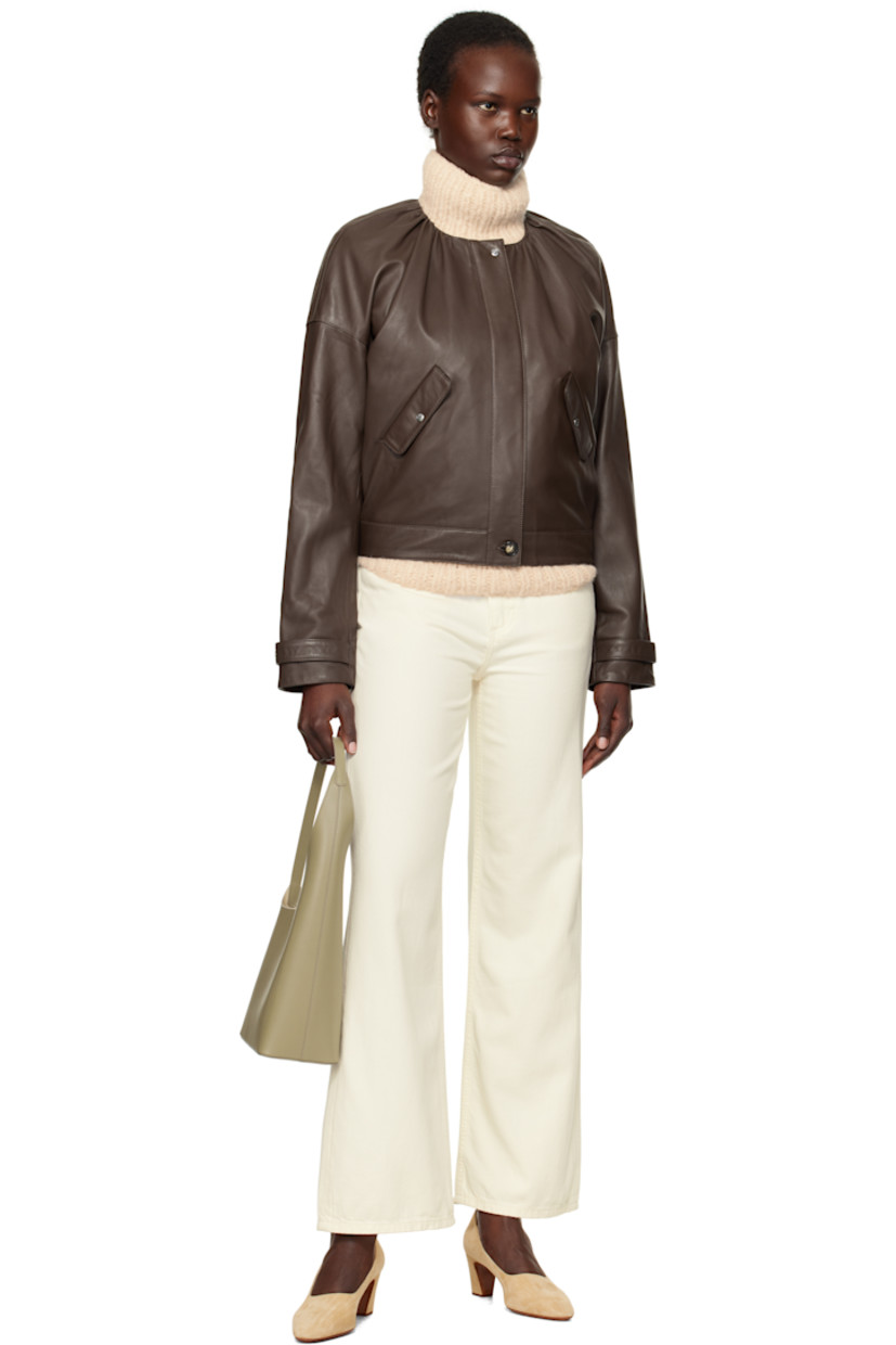 LWG-certified grained lambskin jacket. 

· Gathering at round neck
· Zip closure with press-stud placket
· Flap pockets
· Adjustable press-stud tab at cuffs
· Welt pockets and D-ring at interior
· Full logo-woven satin lining

Supplier color: Chestnut