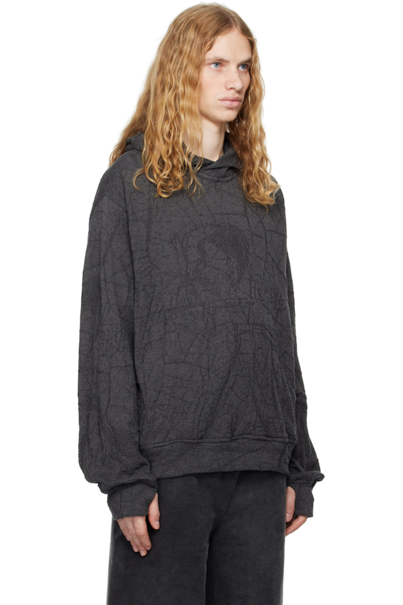 Knit cotton hoodie. Jacquard graphic pattern throughout.

· Kangaroo pocket
· Dropped shoulders
· Thumbhole at cuffs

Part of the RITES OF CARE collection.

Supplier color: Grey