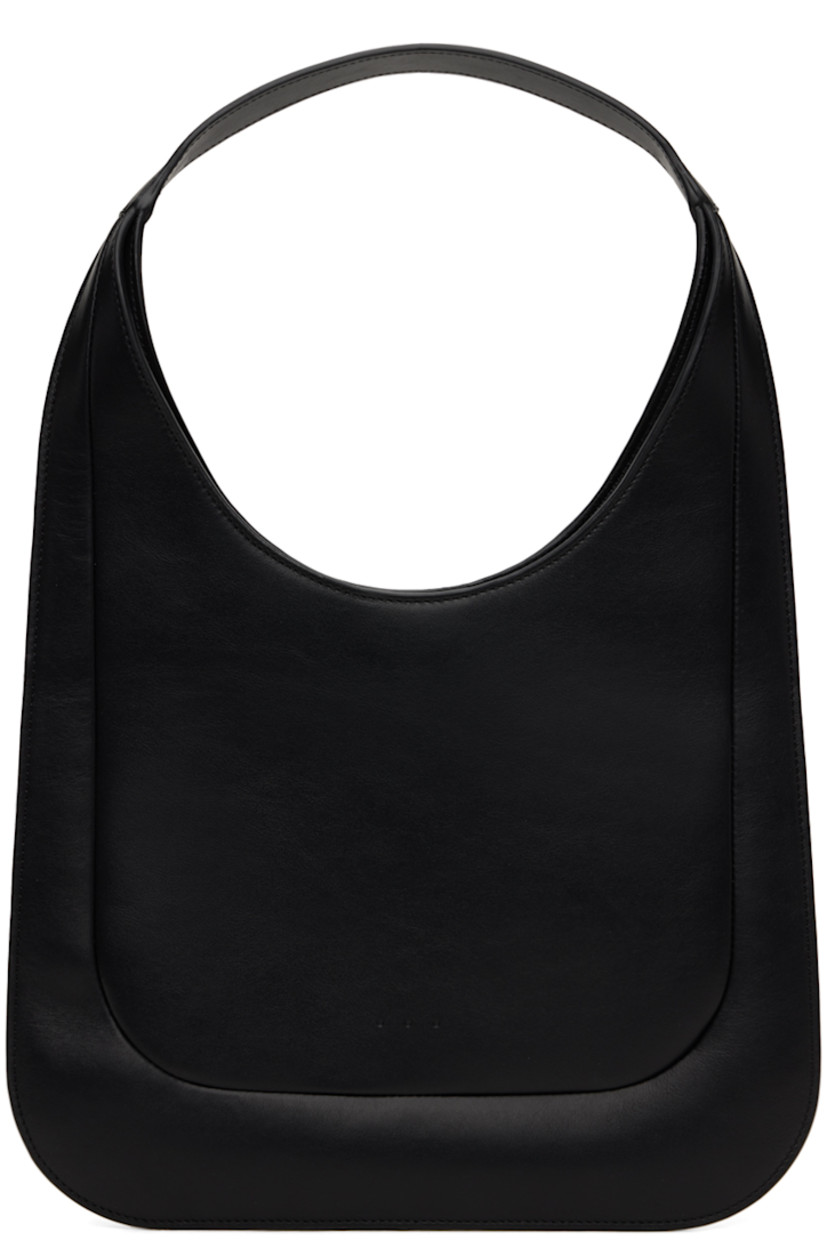 Buffed calfskin shoulder bag in black.

· Integrated shoulder strap
· Magnetic closure
· Card slot at interior
· Faille lining
· H9.5" x W12"
· Total height: 17.5"

Supplier color: Black