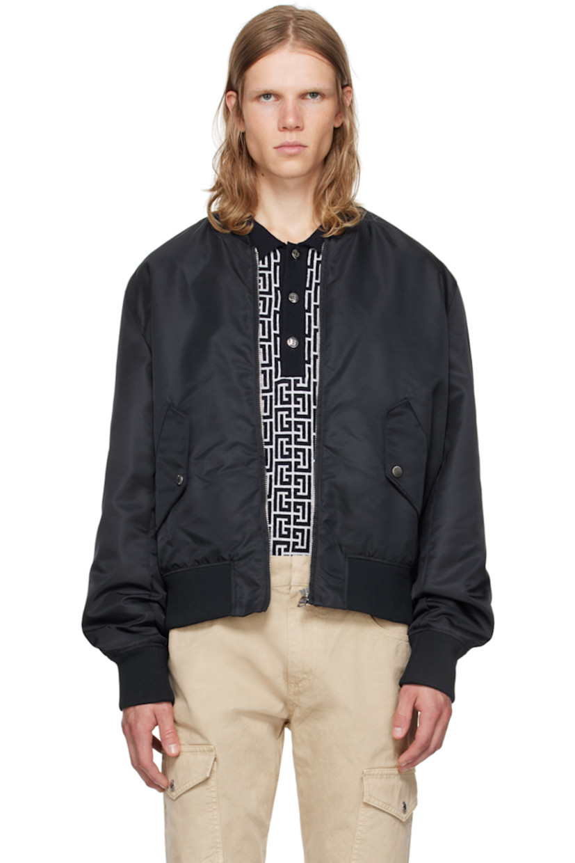 Nylon taffeta bomber jacket.

· Rib knit stand collar, hem, and cuffs
· Zip closure
· Flap pockets 
· Logo embroidered at back
· Welt pocket at interior
· Full acetate-blend satin lining
· Logo-engraved silver-tone hardware

Supplier color: Navy