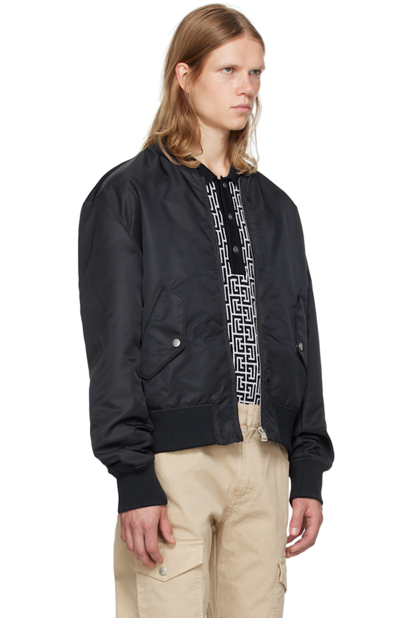 Nylon taffeta bomber jacket.

· Rib knit stand collar, hem, and cuffs
· Zip closure
· Flap pockets 
· Logo embroidered at back
· Welt pocket at interior
· Full acetate-blend satin lining
· Logo-engraved silver-tone hardware

Supplier color: Navy