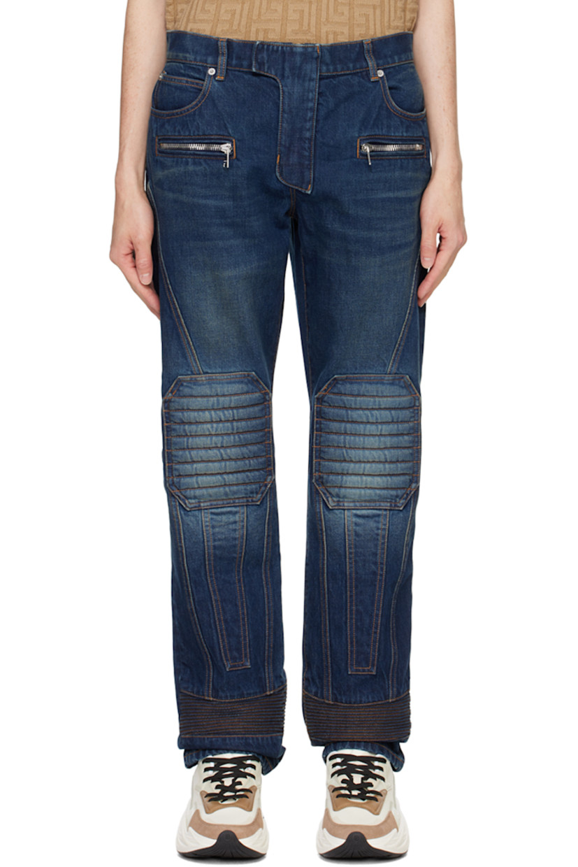 Straight-leg non-stretch denim jeans. Fading, whiskering, and quilted panels throughout.

· Paneled construction
· Belt loops
· Seven-pocket styling
· Zip-fly
· Logo patch at back waistband
· Silver-tone hardware
· Contrast stitching in tan

Supplier color: Navy