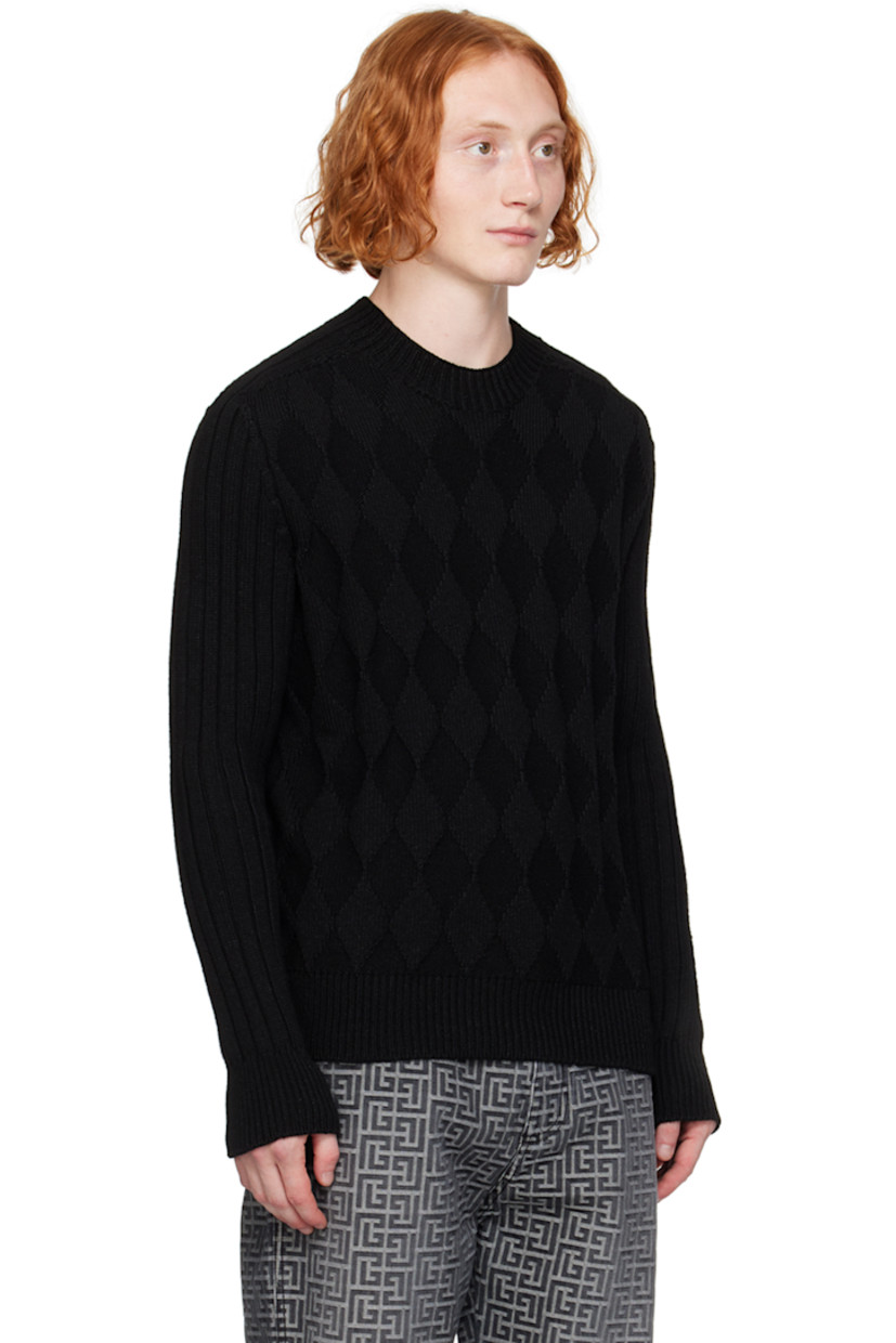 Knit wool- and nylon-blend sweater. Jacquard graphic pattern throughout.

· Rib knit at crewneck, cuffs, and hem
· Logo patch at hem

Supplier color: Noir