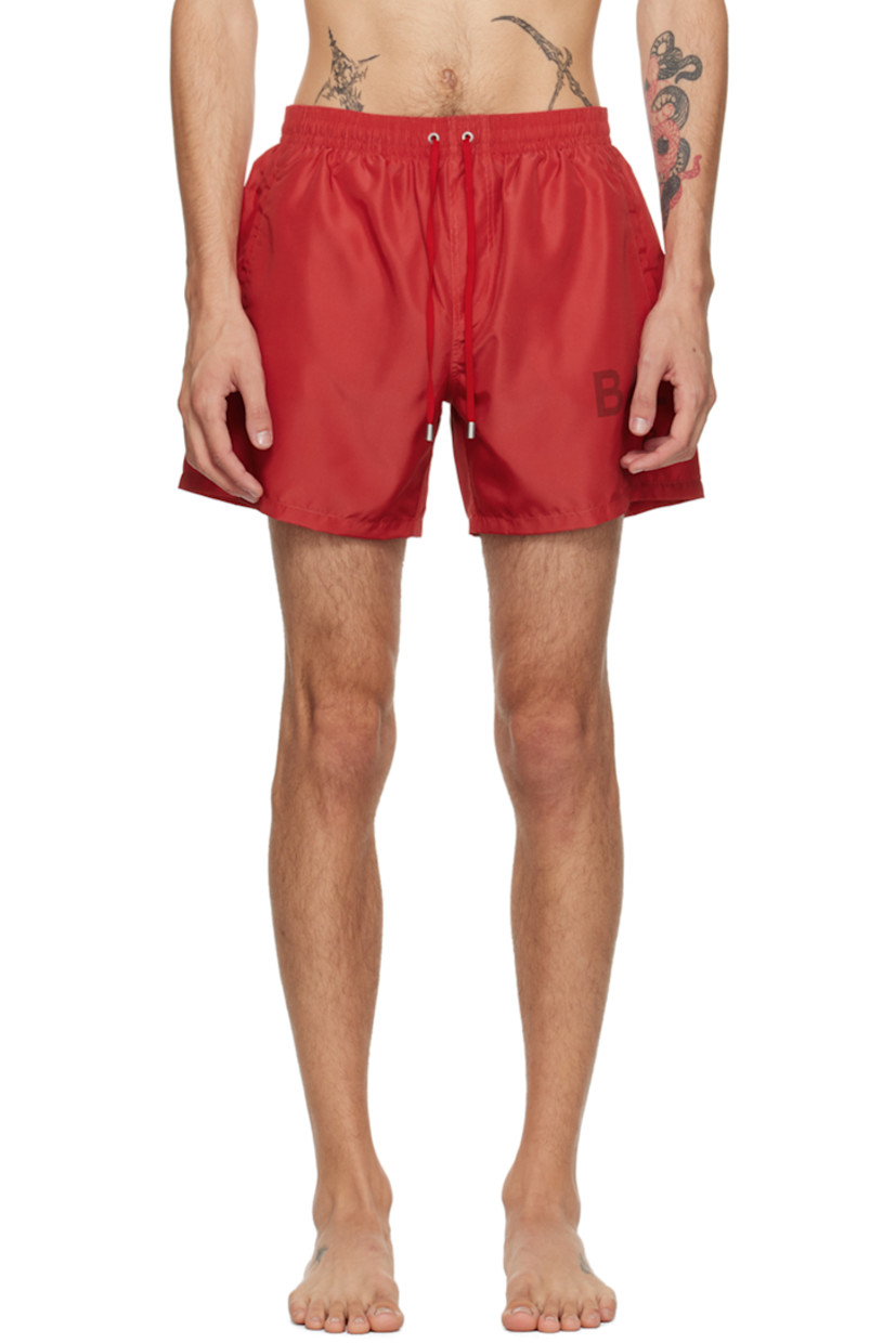 Polyester taffeta swim shorts.

· Drawstring at elasticized waistband
· Two-pocket styling
· Logo printed at outseam
· Partial mesh lining

Supplier color: Red