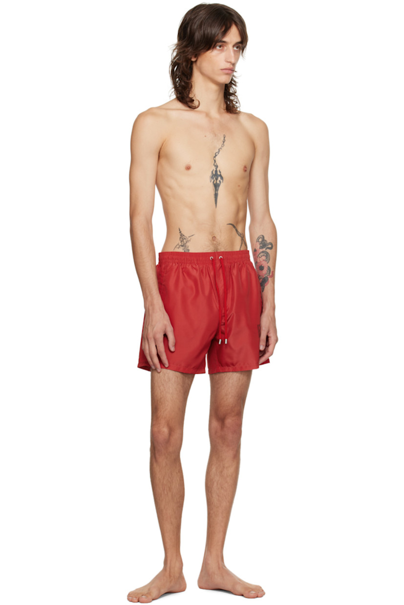 Polyester taffeta swim shorts.

· Drawstring at elasticized waistband
· Two-pocket styling
· Logo printed at outseam
· Partial mesh lining

Supplier color: Red