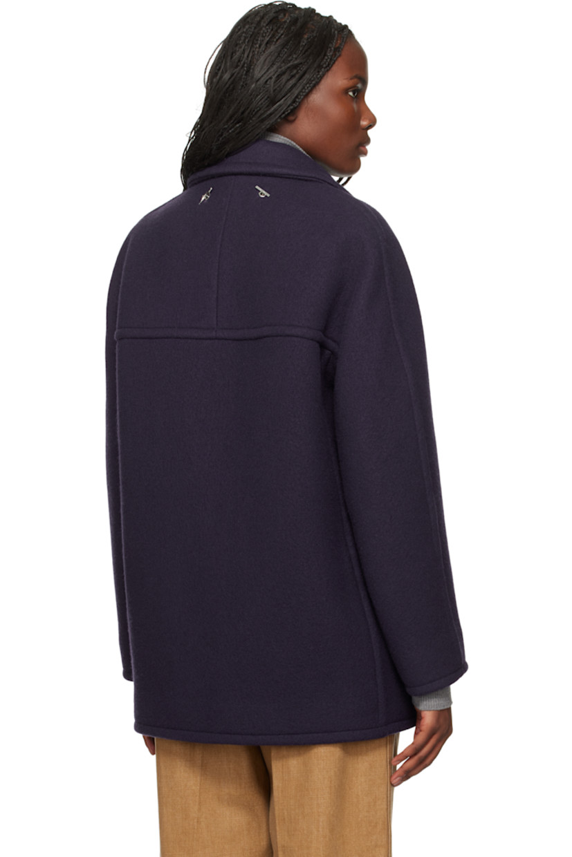 Virgin wool melton peacoat.

· Notched lapel
· Double-breasted button closure
· Flap pockets
· Detachable logo graphic on chain at back collar
· Full viscose twill lining

Supplier color: Ink