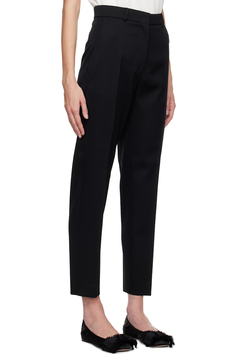 Slim-fit and tapered virgin wool twill trousers.

· Mid-rise
· Belt loops
· Four-pocket styling
· Zip-fly
· Creased legs
· Unfinished hem
· Horn hardware

Supplier color: Black