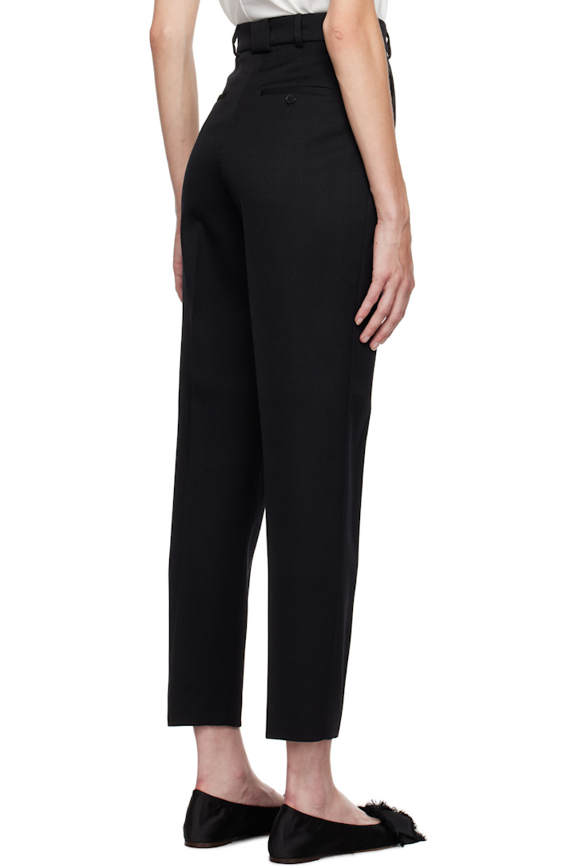 Slim-fit and tapered virgin wool twill trousers.

· Mid-rise
· Belt loops
· Four-pocket styling
· Zip-fly
· Creased legs
· Unfinished hem
· Horn hardware

Supplier color: Black