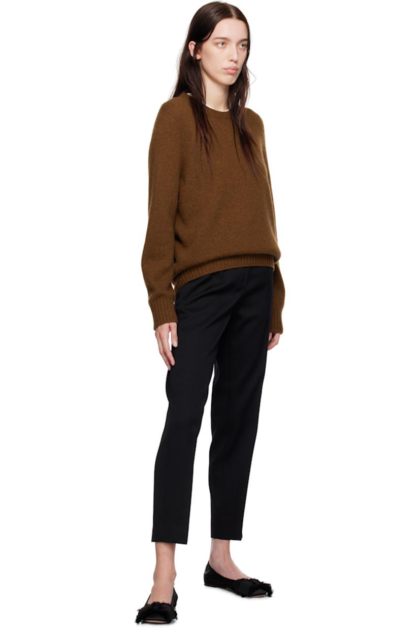 Slim-fit and tapered virgin wool twill trousers.

· Mid-rise
· Belt loops
· Four-pocket styling
· Zip-fly
· Creased legs
· Unfinished hem
· Horn hardware

Supplier color: Black