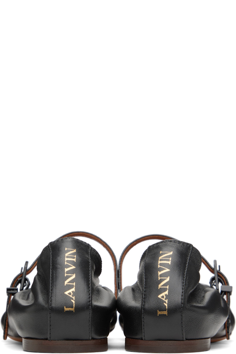 Buffed calfskin Mary Jane-style ballerina flats in black.

· Pin-buckle strap at vamp
· Logo stamp at heel
· Buffed goatskin lining
· Leather sole with rubber injection

Supplier color: Black