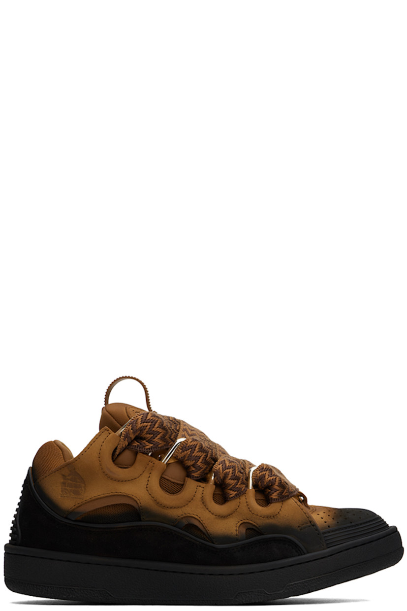 Low-top calfskin suede and mesh sneakers in tan and black. Spray paint effect throughout. 

· Piping, cutouts, and rubberized trim throughout
· Perforated detailing at toe
· Lace-up closure
· Pull-loop and embossed logo at tongue
· Padded tongue and collar
· Logo embossed at outer side
· Jersey lining
· Treaded rubber sole

Available exclusively at SSENSE.

Supplier color: Brown/Black