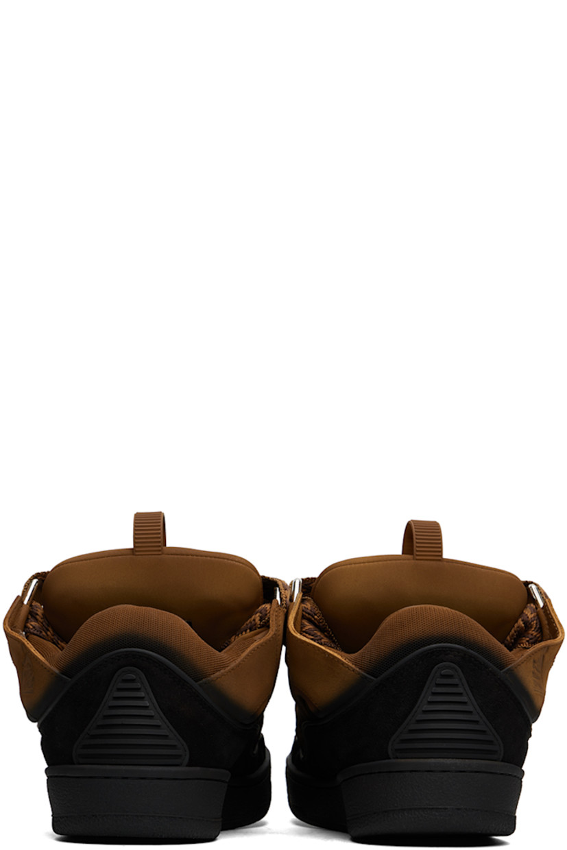 Low-top calfskin suede and mesh sneakers in tan and black. Spray paint effect throughout. 

· Piping, cutouts, and rubberized trim throughout
· Perforated detailing at toe
· Lace-up closure
· Pull-loop and embossed logo at tongue
· Padded tongue and collar
· Logo embossed at outer side
· Jersey lining
· Treaded rubber sole

Available exclusively at SSENSE.

Supplier color: Brown/Black
