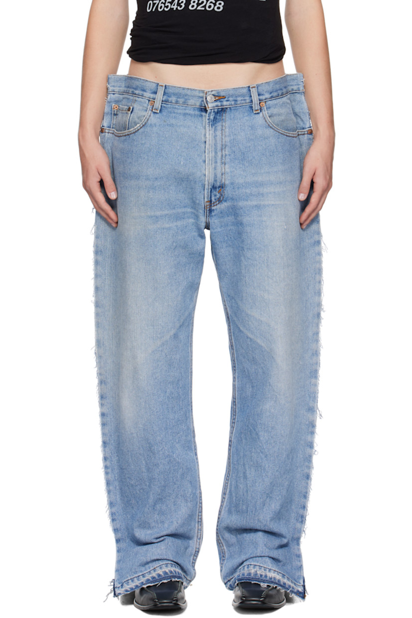 Upcycled non-stretch denim jeans. Fading, whiskering, distressing, and raw edges throughout.

· Belt loops
· Five-pocket styling
· Zip-fly
· Logo flag at back pocket
· Logo-engraved silver-tone hardware

Supplier color: Blue