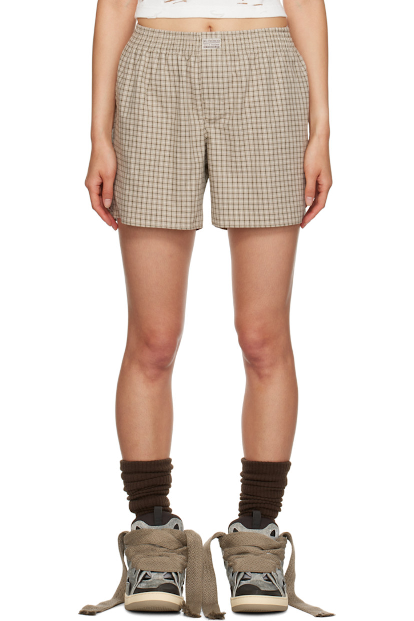Cotton flannel boy shorts. Check pattern throughout.

· Logo patch at elasticized waistband
· Open-fly

Supplier color: Beige plaid