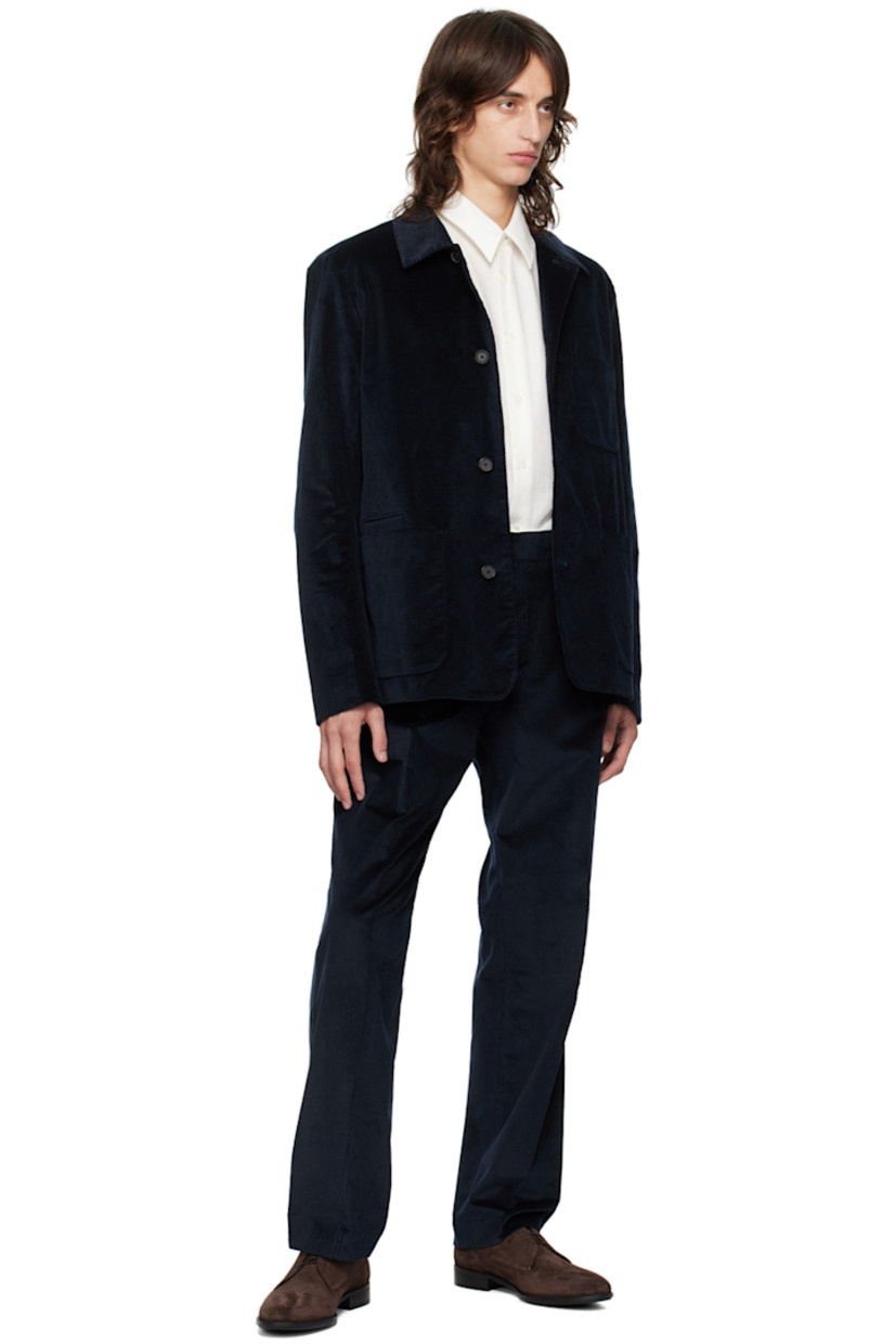 Stretch cotton- and wool-blend corduroy blazer. 

· Spread collar
· Button closure
· Patch pockets 
· Welt pockets at interior
· Full viscose satin lining

Supplier color: Blues