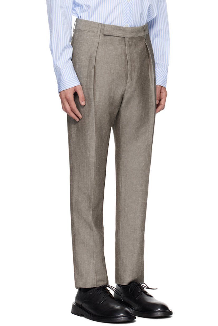 Linen- and wool-blend twill trousers. 

· Adjustable cinch tab at waistband
· Four-pocket styling 
· Zip-fly
· Central creases at front and back
· Partial viscose satin lining 

Supplier color: Browns