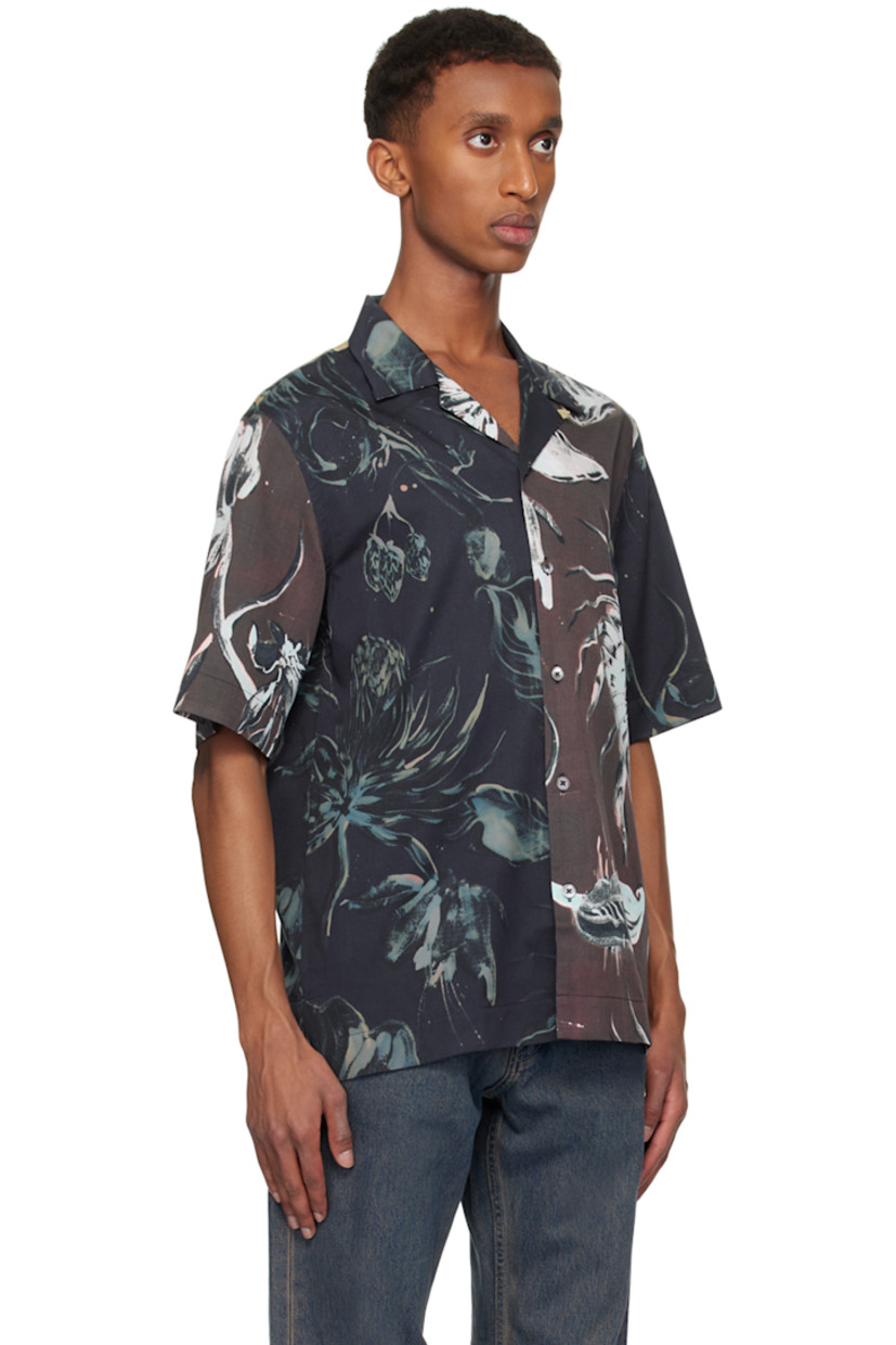Lightweight lyocell- and cotton-blend twill shirt. Floral pattern throughout.

· Paneled construction
· Open spread collar
· Button closure
· Tennis-tail hem

Supplier color: Navy
