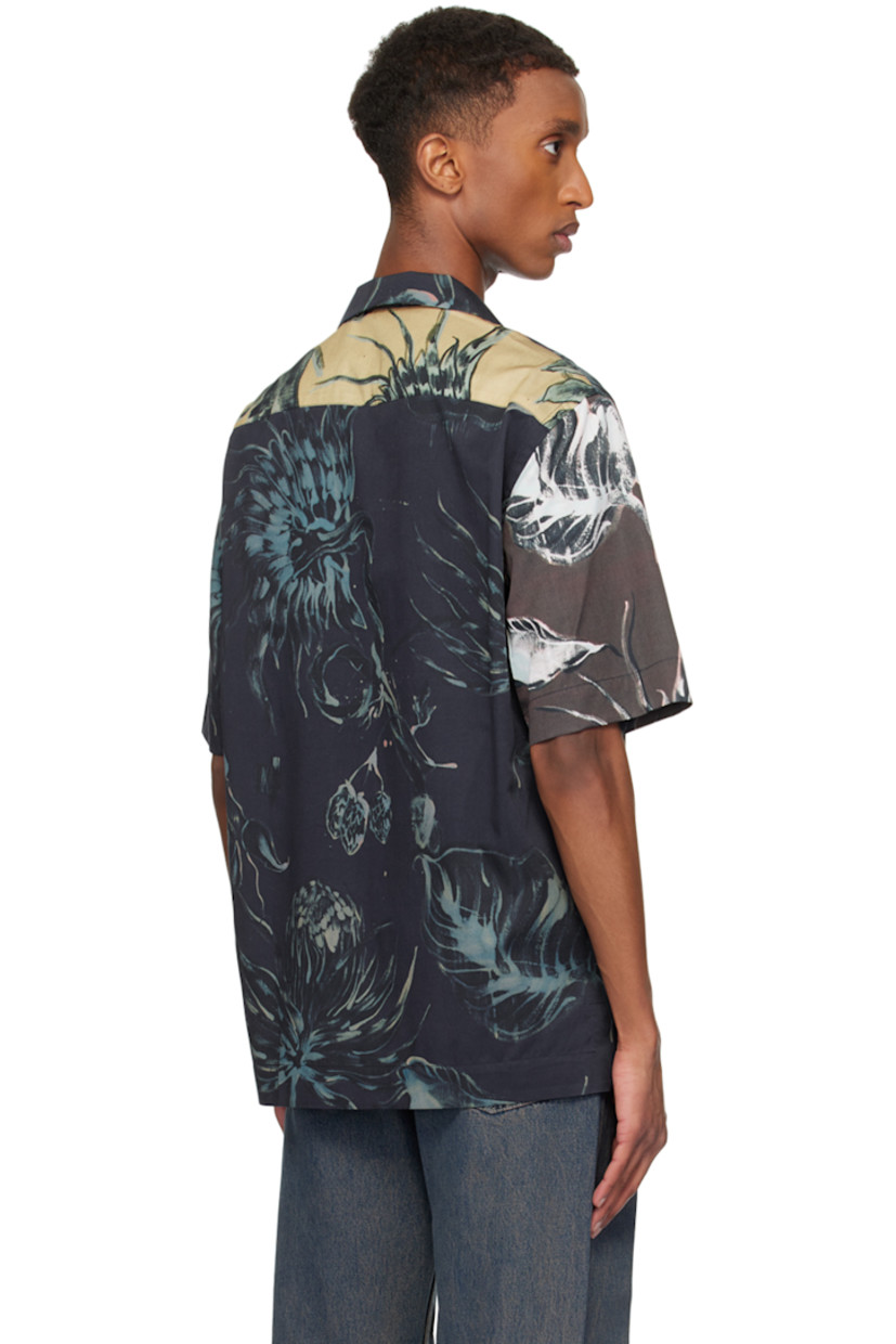 Lightweight lyocell- and cotton-blend twill shirt. Floral pattern throughout.

· Paneled construction
· Open spread collar
· Button closure
· Tennis-tail hem

Supplier color: Navy