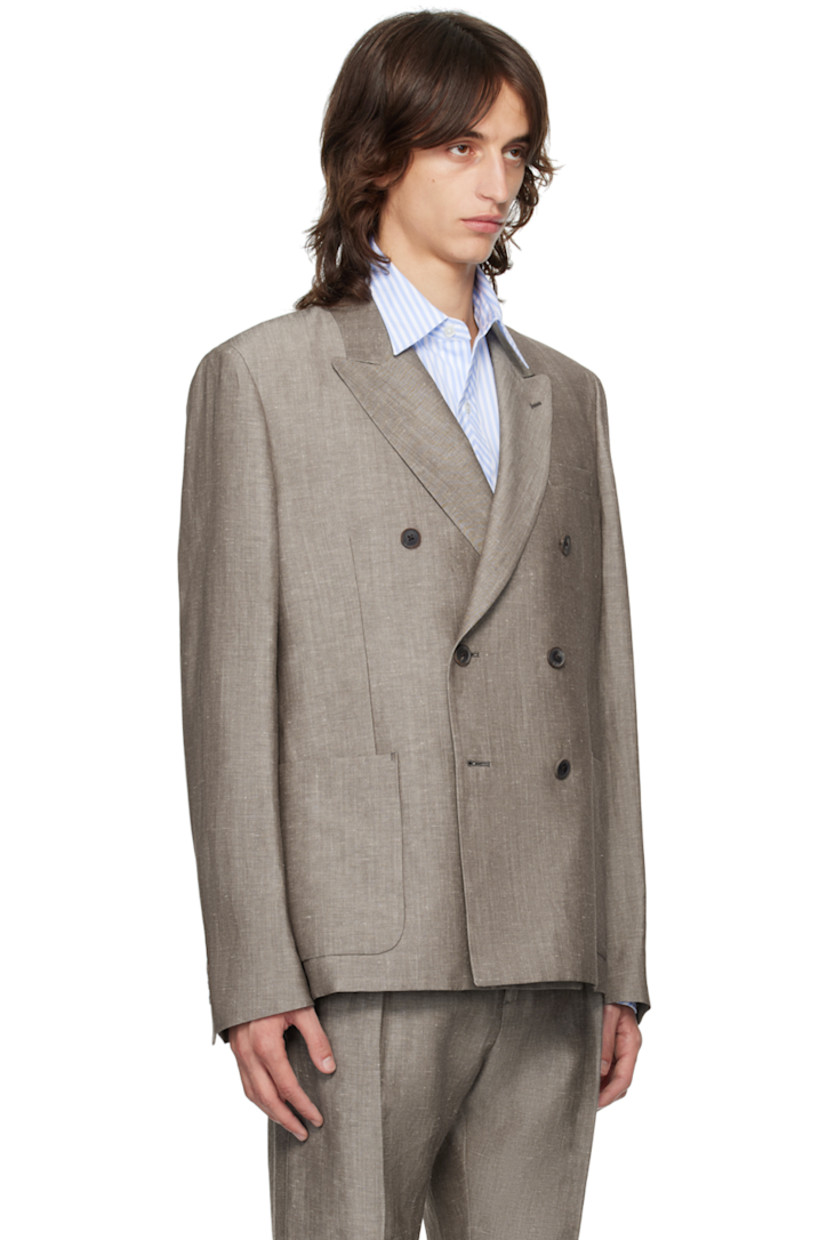 Linen- and wool-blend twill blazer.

· Peaked lapel
· Double-breasted button closure 
· Welt and patch pockets
· Three-button surgeon's cuffs
· Twin vents at back hem
· Welt pockets at interior
· Partial cupro satin lining

Supplier color: Browns