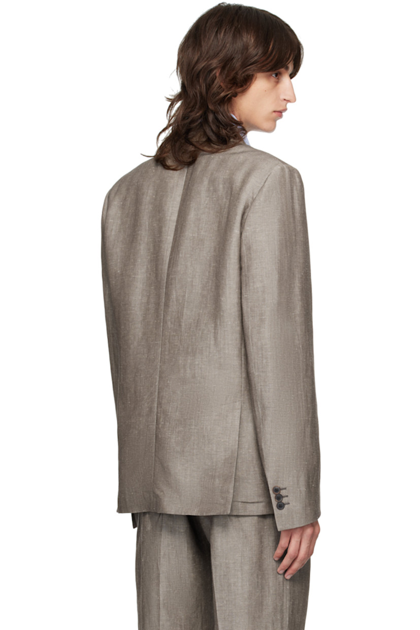 Linen- and wool-blend twill blazer.

· Peaked lapel
· Double-breasted button closure 
· Welt and patch pockets
· Three-button surgeon's cuffs
· Twin vents at back hem
· Welt pockets at interior
· Partial cupro satin lining

Supplier color: Browns