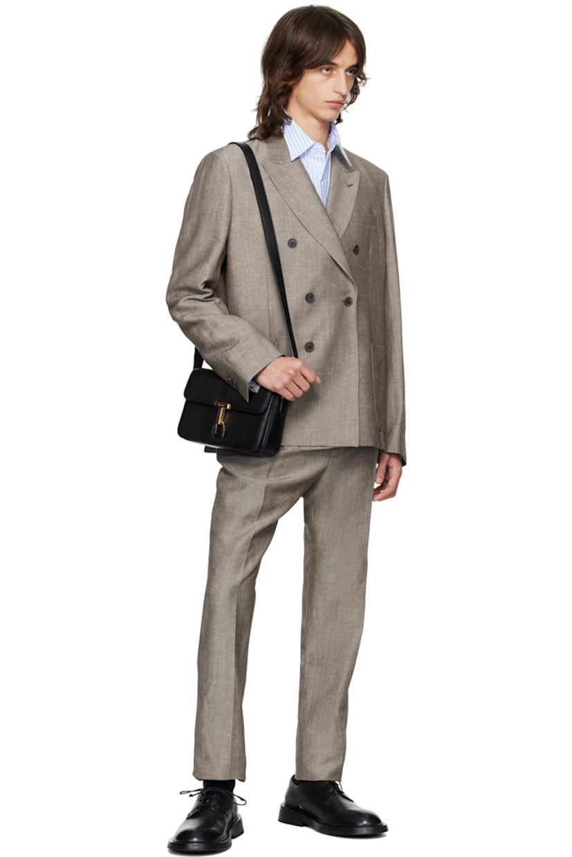 Linen- and wool-blend twill blazer.

· Peaked lapel
· Double-breasted button closure 
· Welt and patch pockets
· Three-button surgeon's cuffs
· Twin vents at back hem
· Welt pockets at interior
· Partial cupro satin lining

Supplier color: Browns
