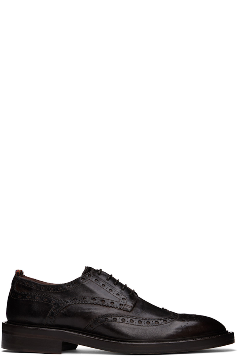 Polished grained buffalo leather derbys in brown.

· Brogue and serrated detailing throughout
· Almond toe
· Lace-up closure
· Striped grosgrain trim at heel
· Buffed leather and suede lining
· Stacked leather heel with rubber injection
· Polished leather sole
· Heel: H1.5"

Supplier color: Dark brown