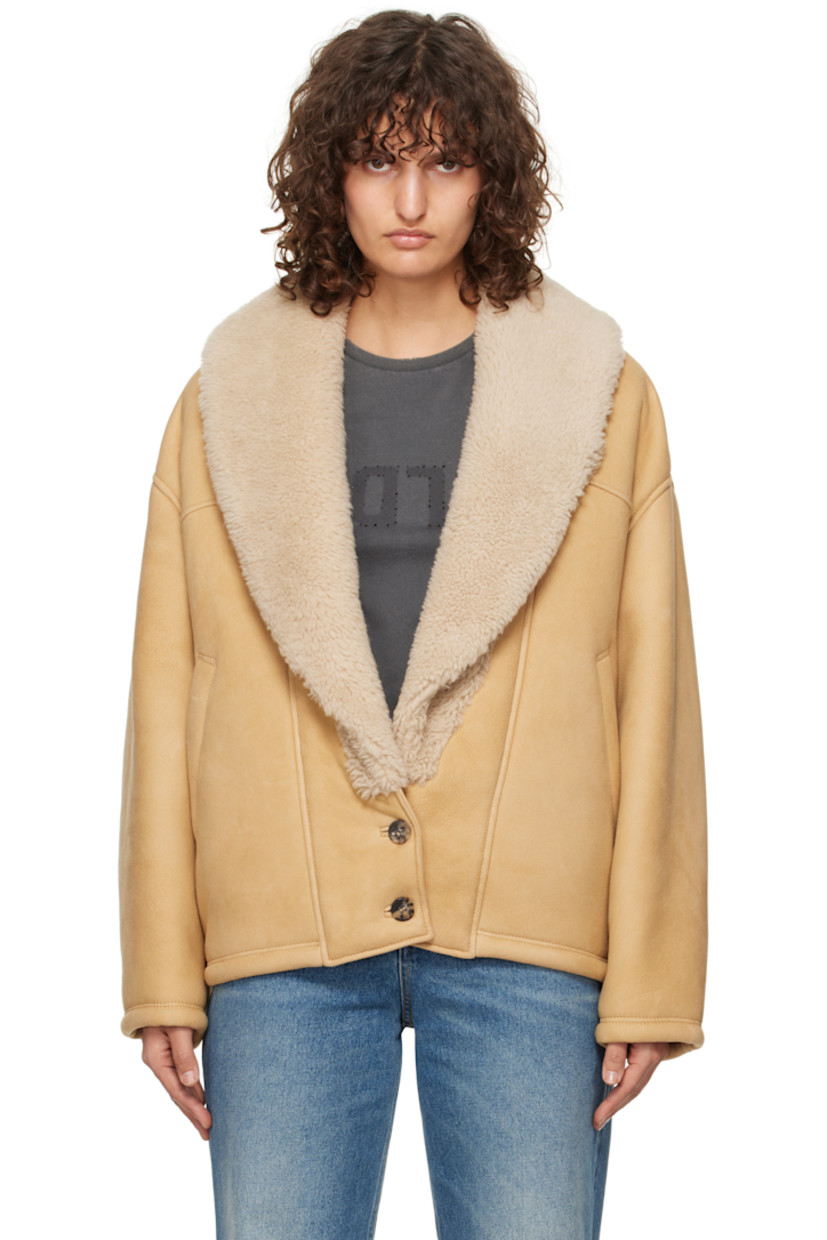 Sheepskin suede jacket.

· Shearling trim at shawl lapel
· Two-button closure
· Welt pockets
· Dropped shoulders
· Logo hardware at back collar
· Full shearling lining

Part of the Journey collection.

Supplier color: Lark