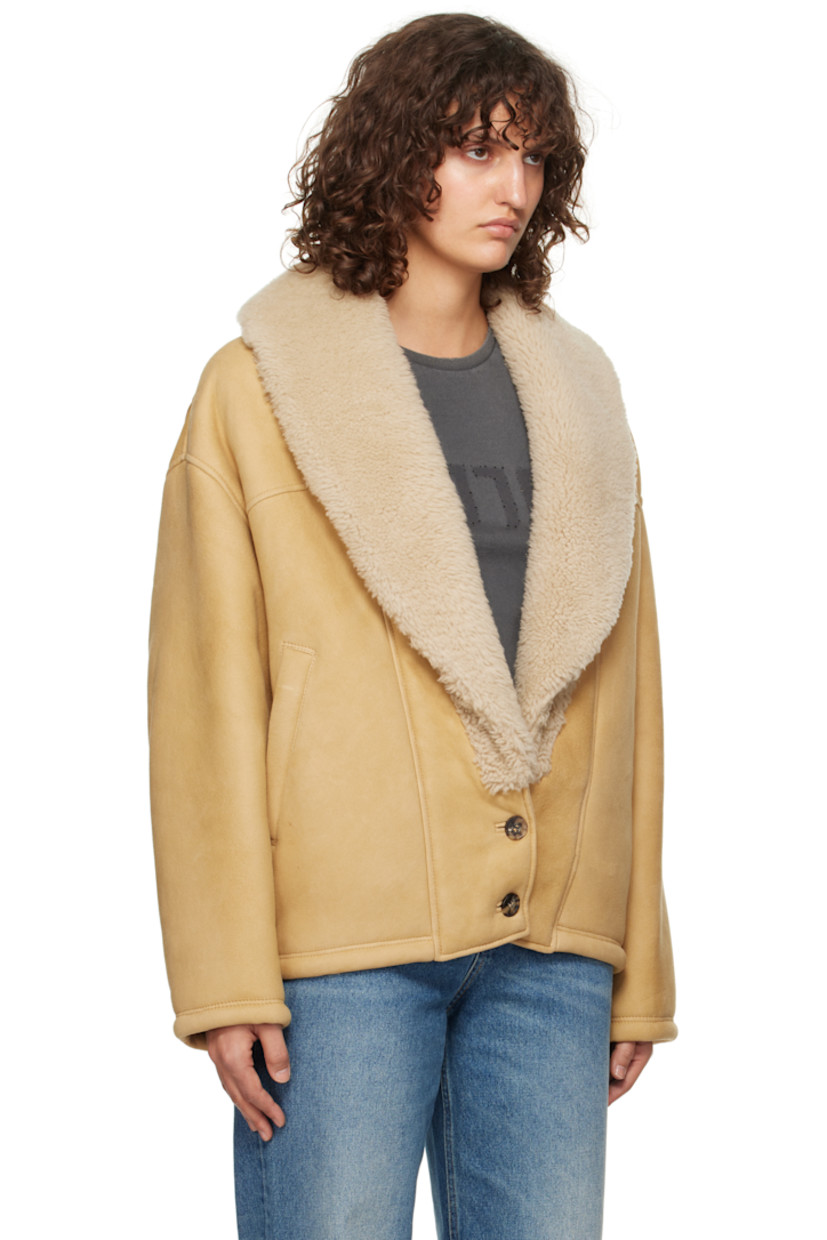 Sheepskin suede jacket.

· Shearling trim at shawl lapel
· Two-button closure
· Welt pockets
· Dropped shoulders
· Logo hardware at back collar
· Full shearling lining

Part of the Journey collection.

Supplier color: Lark