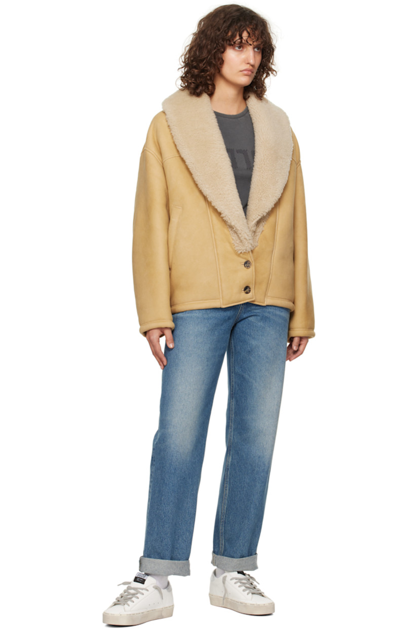 Sheepskin suede jacket.

· Shearling trim at shawl lapel
· Two-button closure
· Welt pockets
· Dropped shoulders
· Logo hardware at back collar
· Full shearling lining

Part of the Journey collection.

Supplier color: Lark