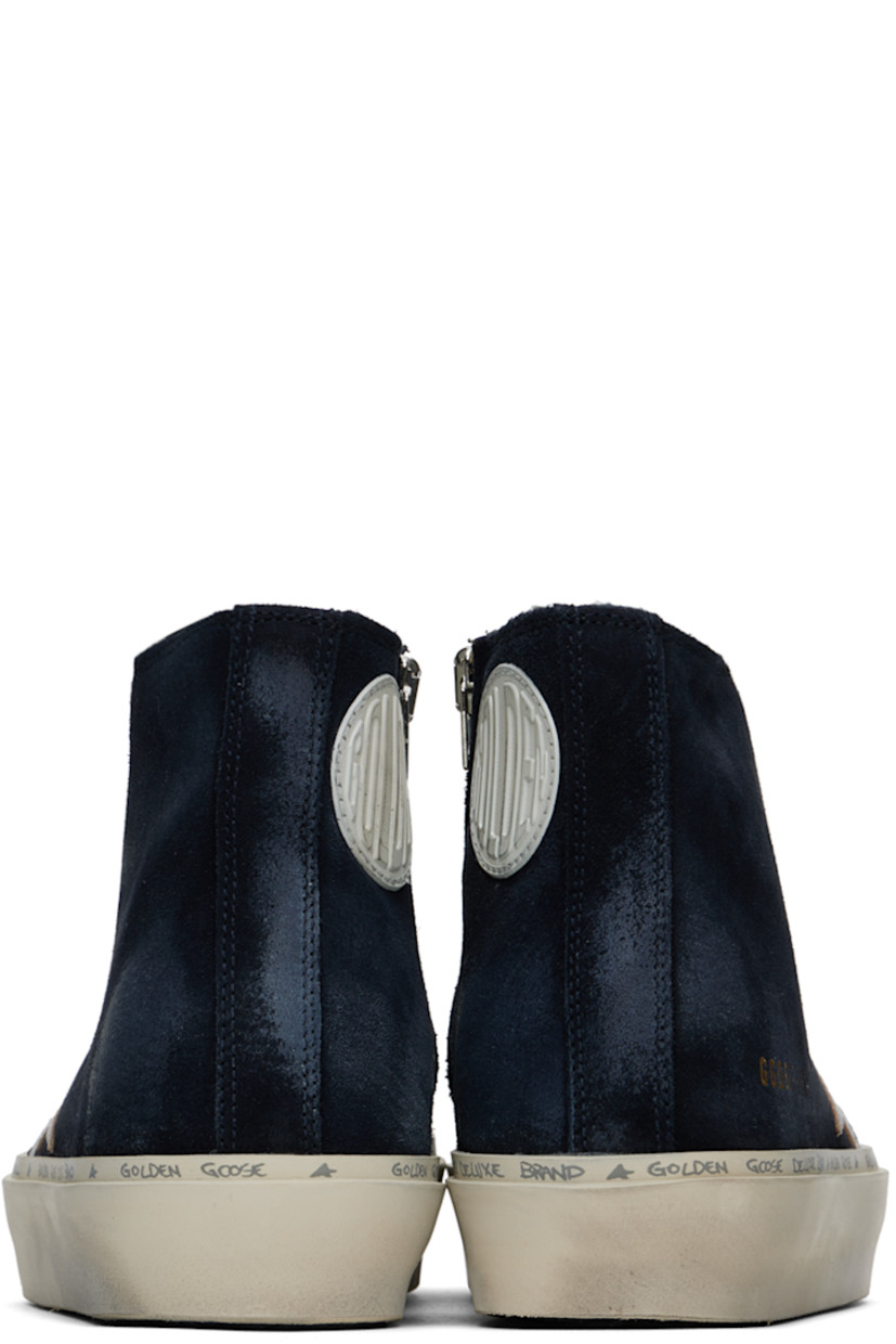Handcrafted high-top suede sneakers in navy. Smudging throughout.

· Lace-up closure
· Logo embossed at tongue
· Perforated detailing at sides
· Zip closure at inner side
· Rubberized logo patch at inner side
· Signature star appliqué at outer side
· Logo stamp at outer side
· Terrycloth lining
· Logo and text printed at welt
· Treaded rubber sole

Supplier color: Blue/Silver